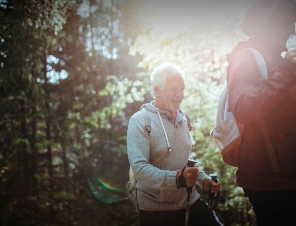 retiree hiking with a walking stick