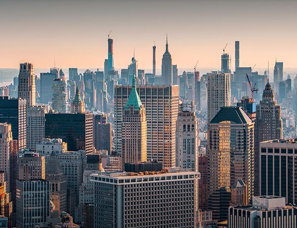 Skyline of tall buildings at sunset