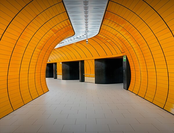 Curved hallway with yellow tiles